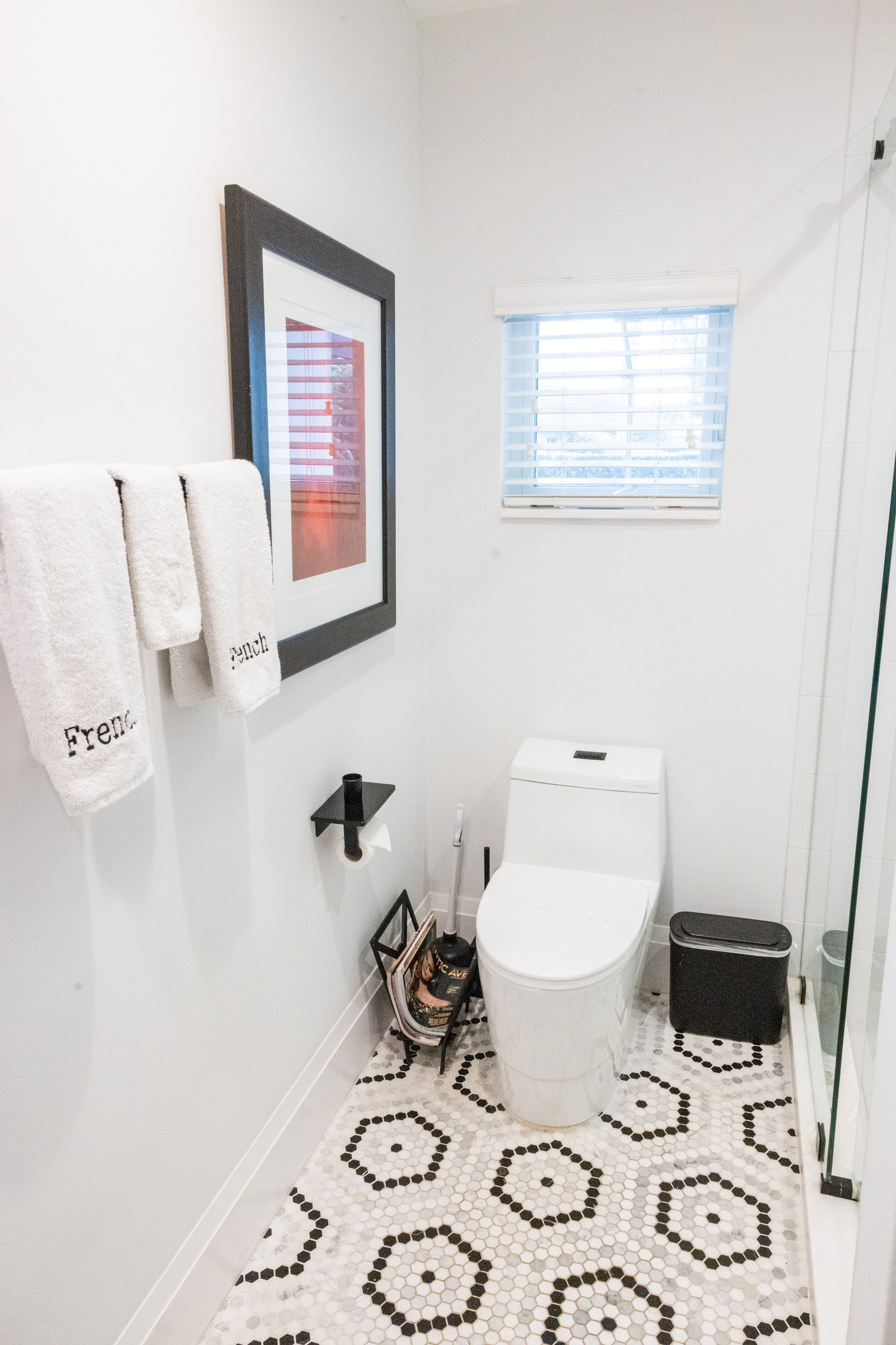 Powder room with whimsical monkey wallpaper and vessel sink