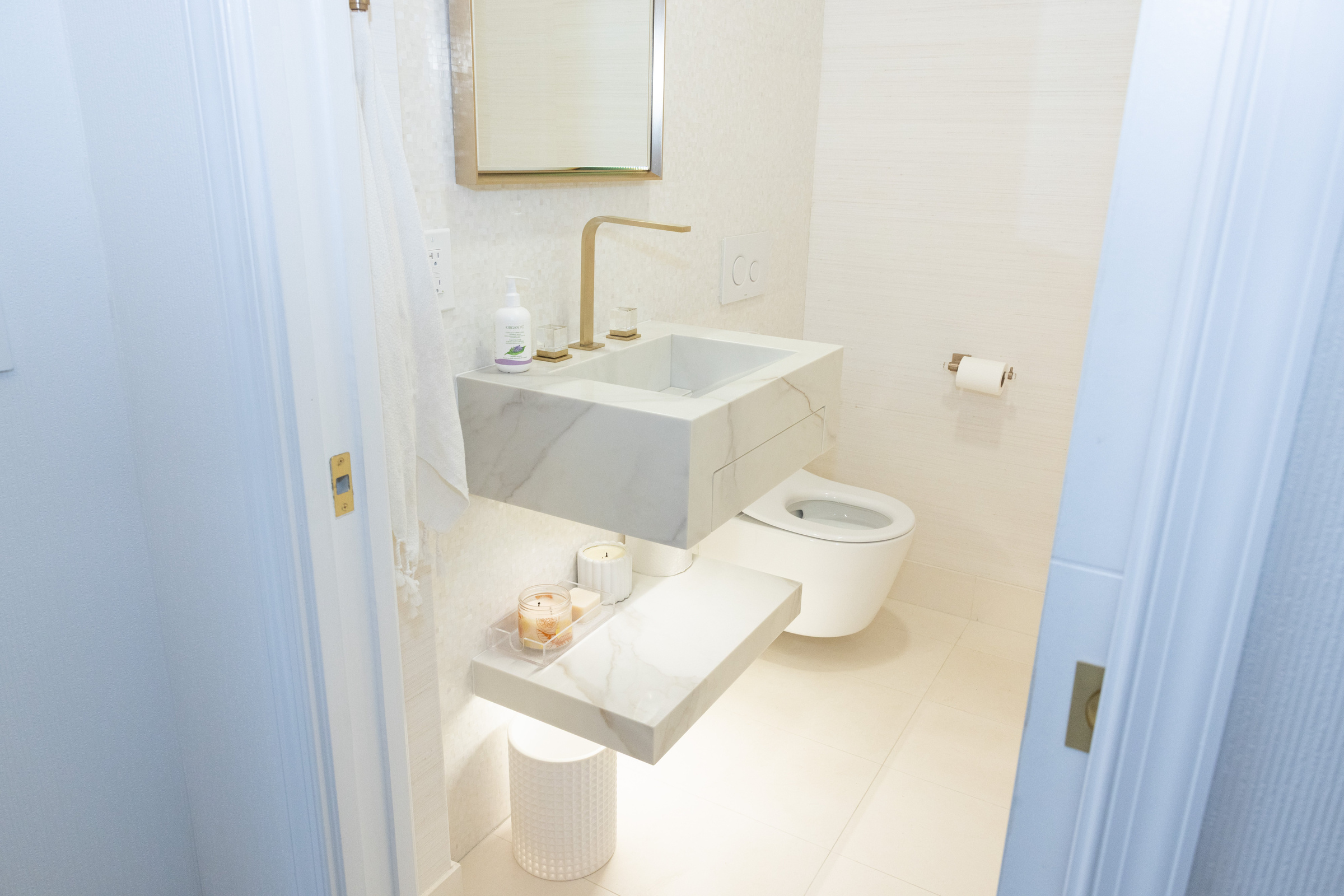 Guest bath floating vanity with hex tile floor and medicine cabinet